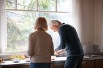 man and woman in kitchen together