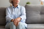 woman sitting on couch.